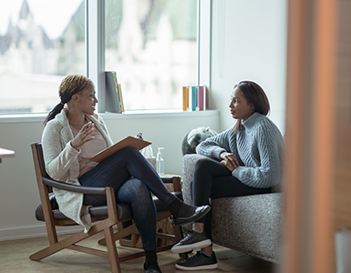 Two women discussing a chart