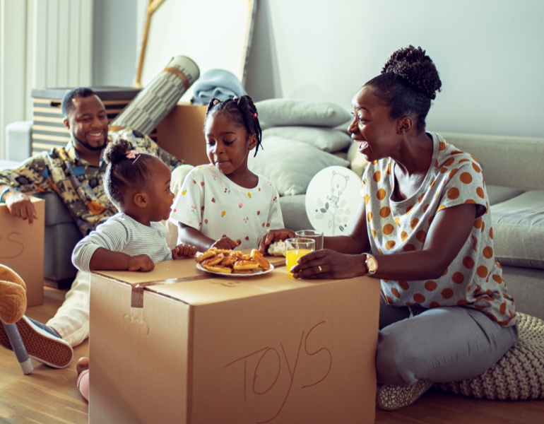 Family sitting around table eating breakfast